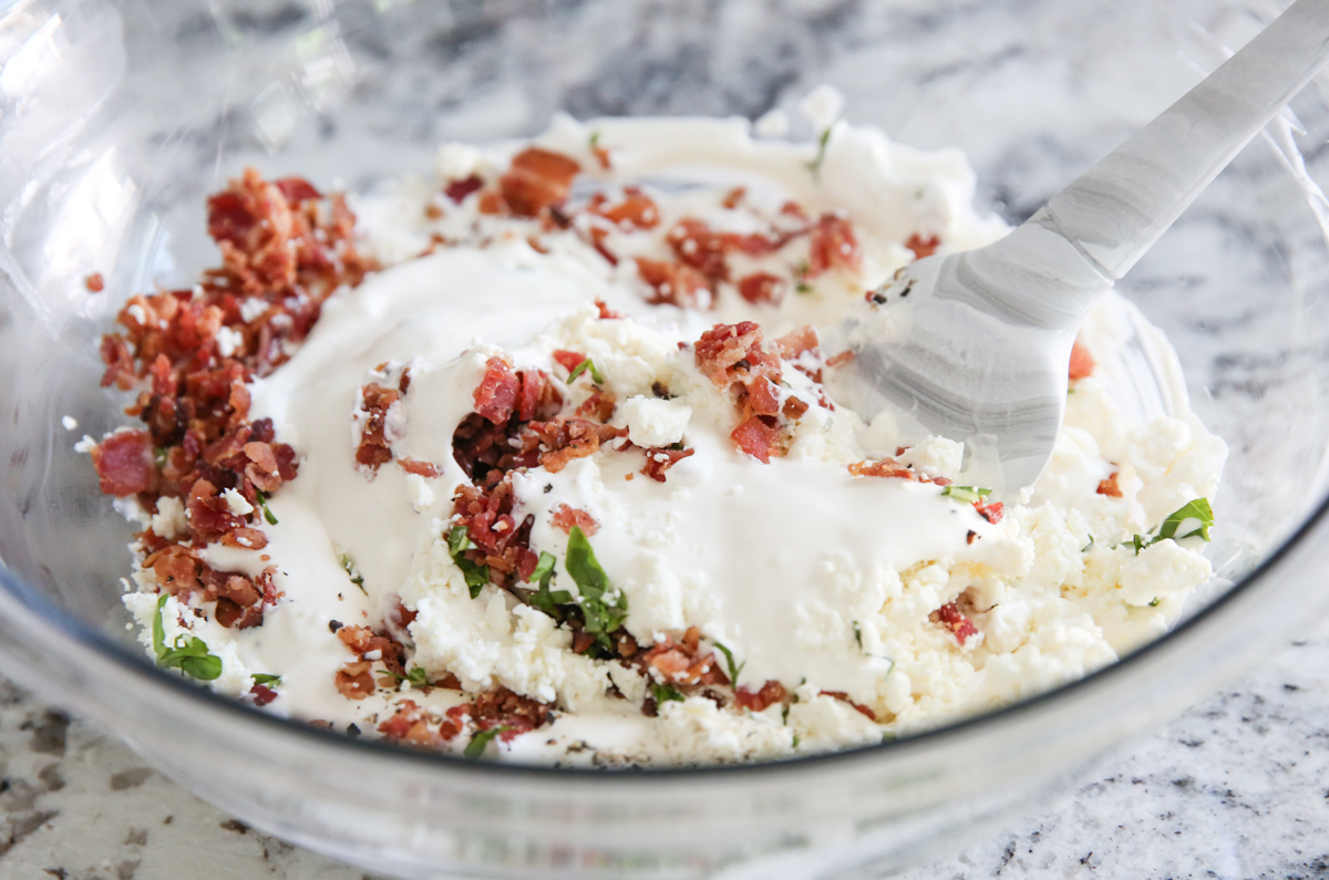 mixing bacon tomato basil dip 