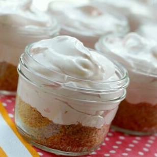 Frozen lemonade pies in jars, ready to be gifted.