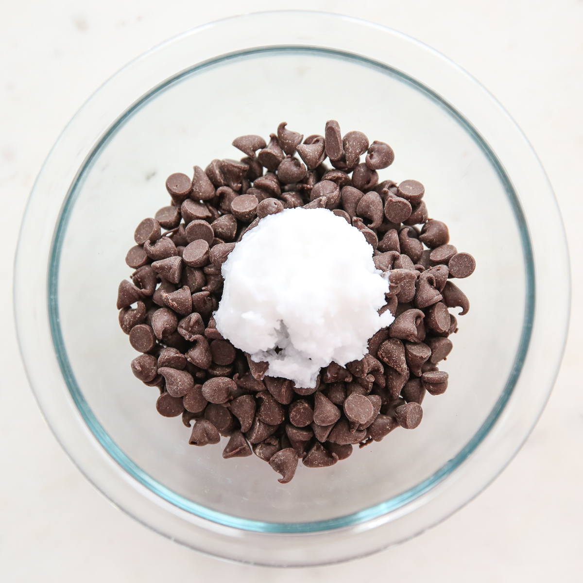 our best bites coconut oil and chocolate chips for magic shell topping