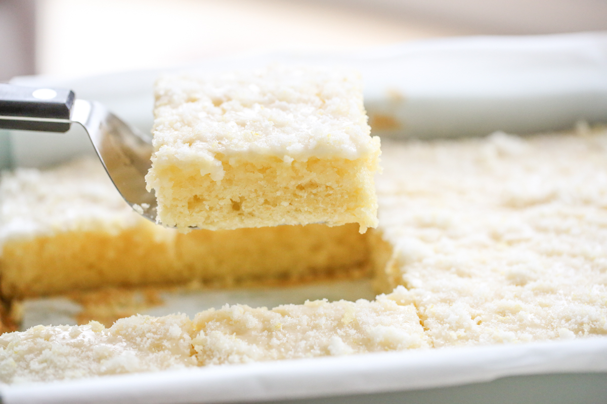lemon buttermilk cake being lifted out of pan