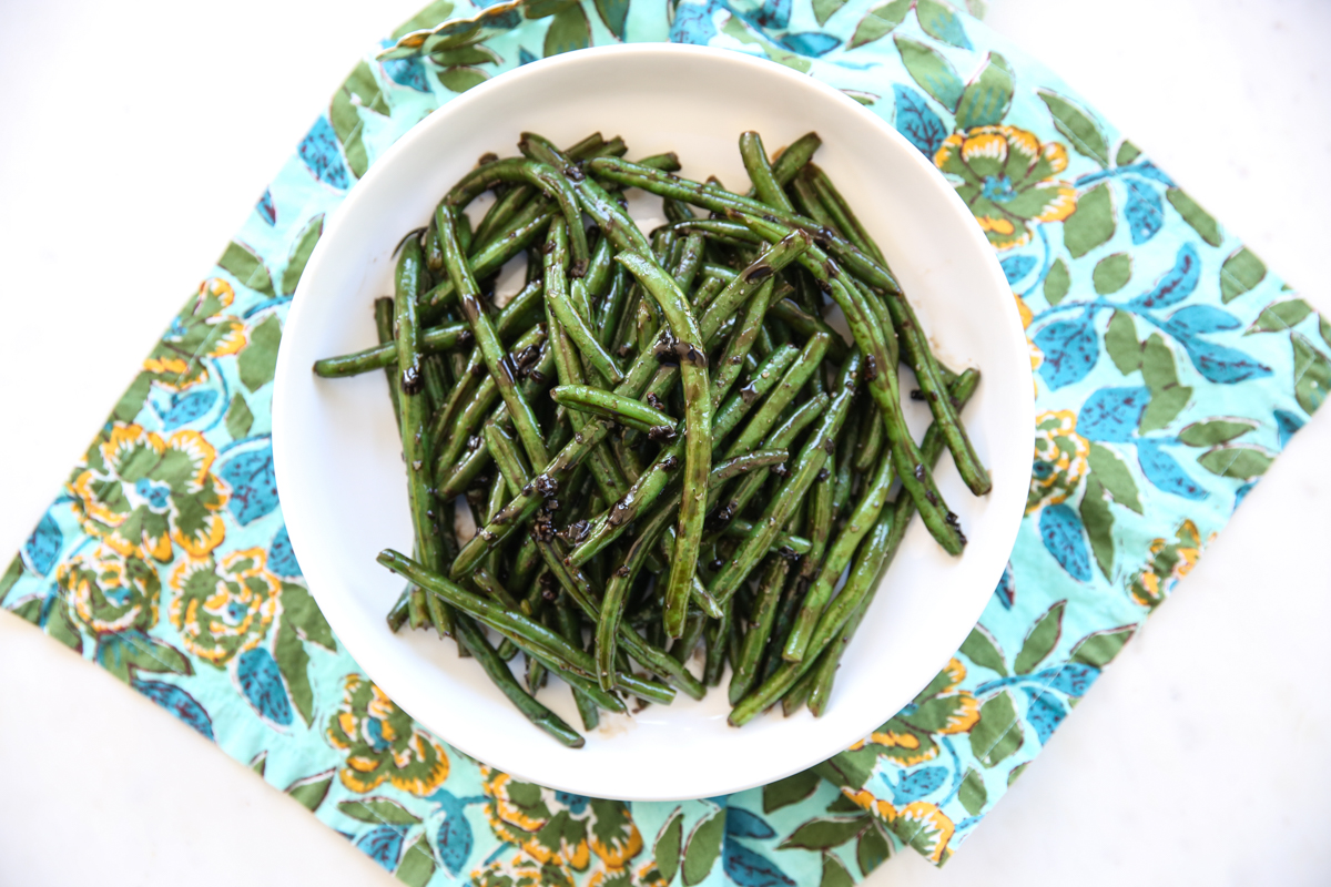 balsamic green beans in a white serving dish