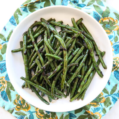 balsamic green beans in a white serving dish
