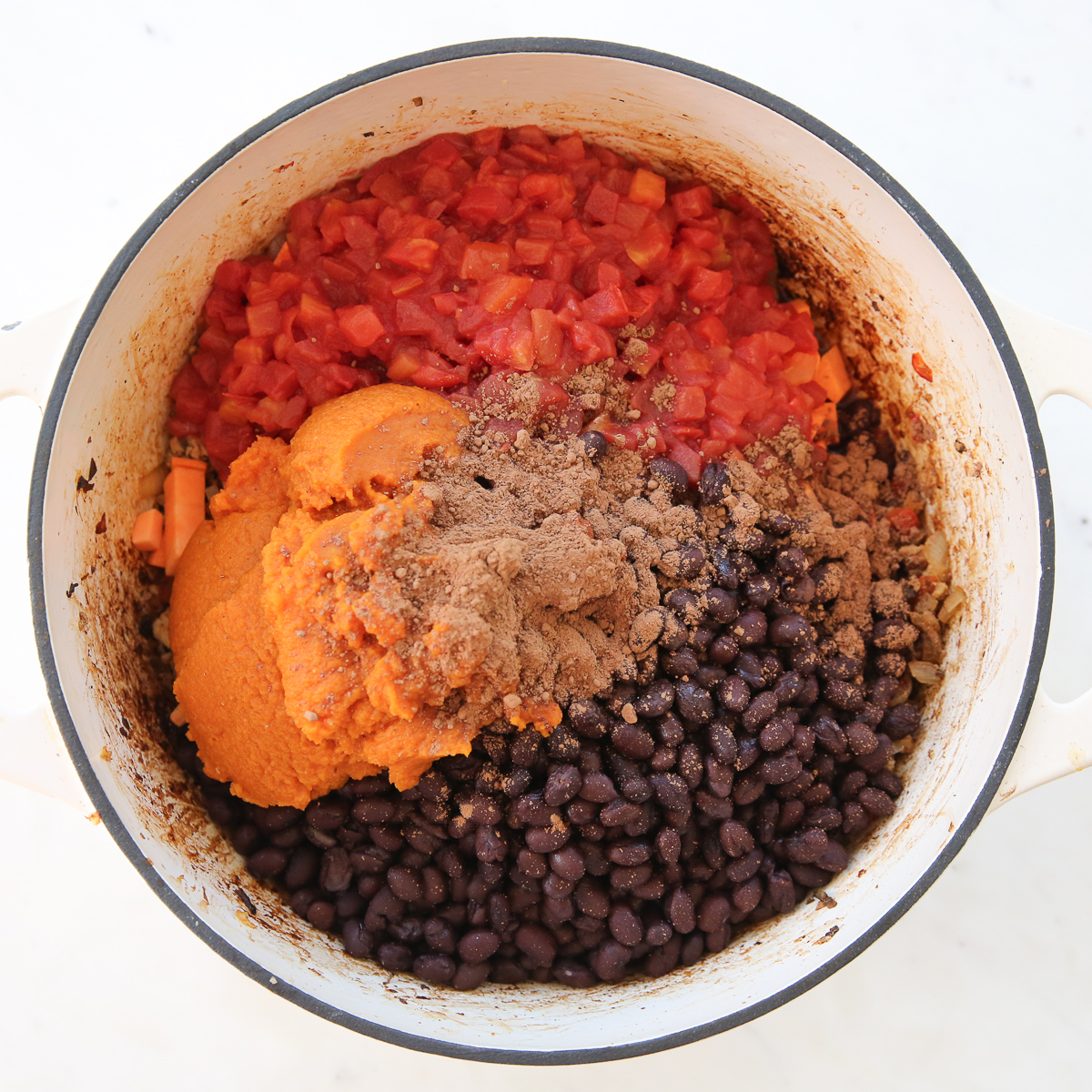 ingredients for sweet potato chili in a pot