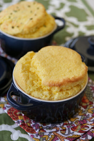 Sweet and savory varieties of spoonbread in blue ramekins. 