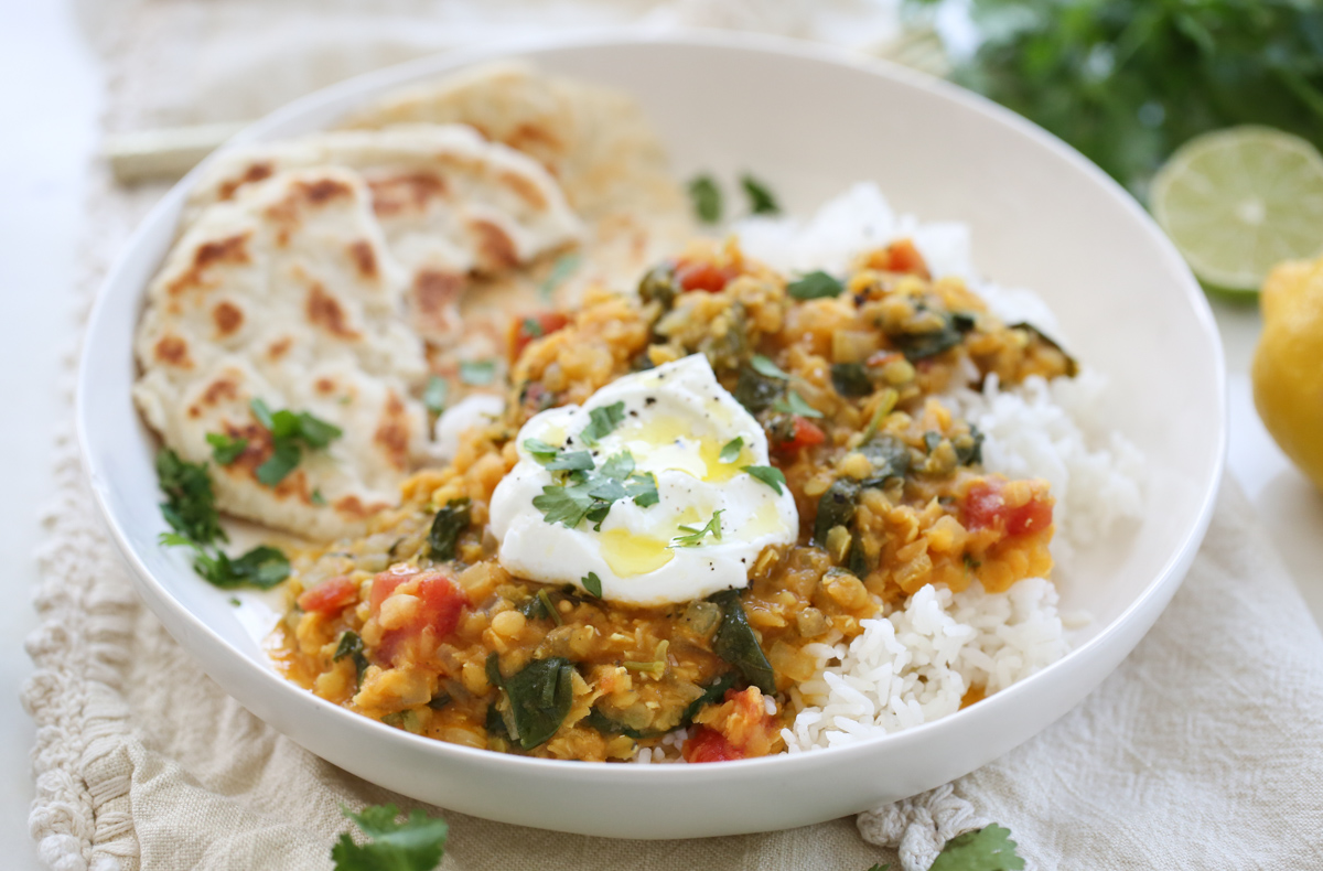 red lentils in a white bowl over rice
