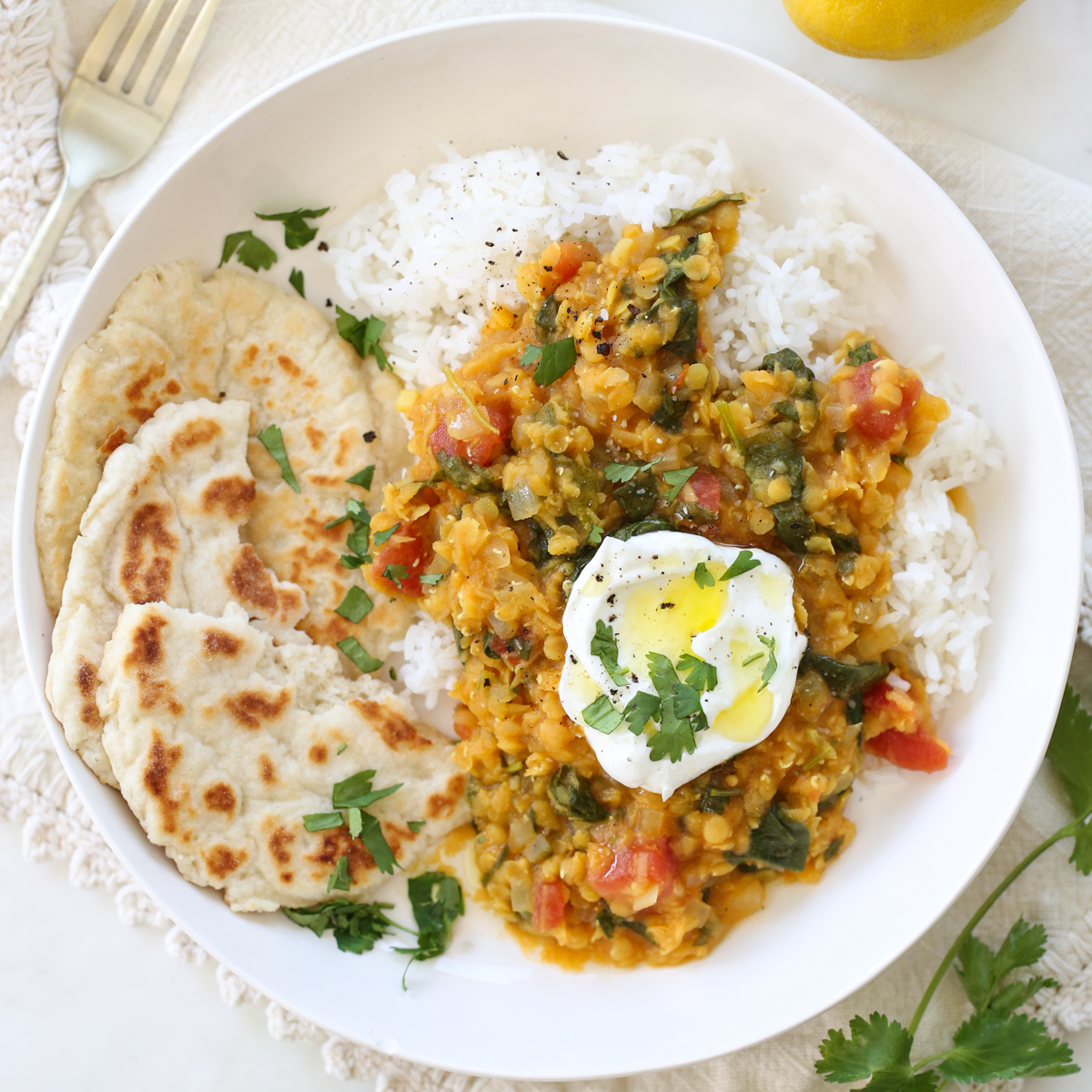 Indian spiced red lentils over rice in a bowl