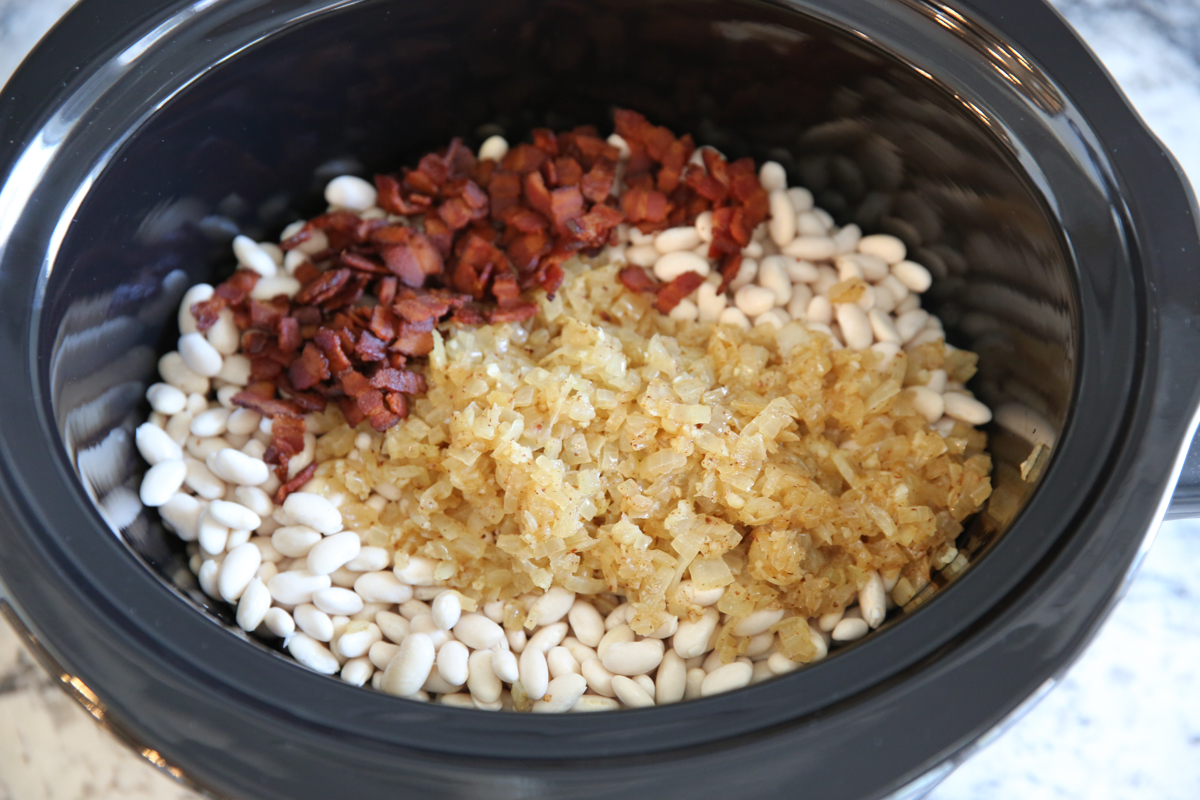 white beans, onions, and bacon in a slow cooker