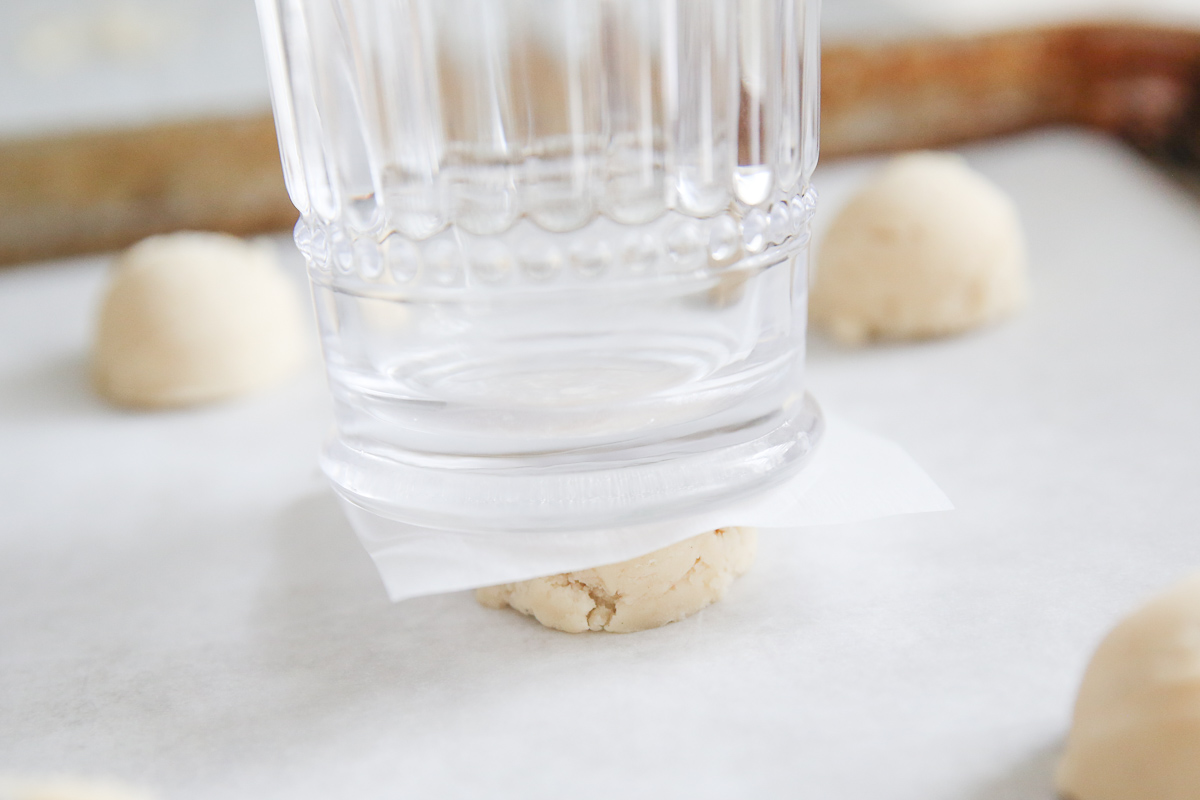 using a glass to flatten out peppermint meltaways