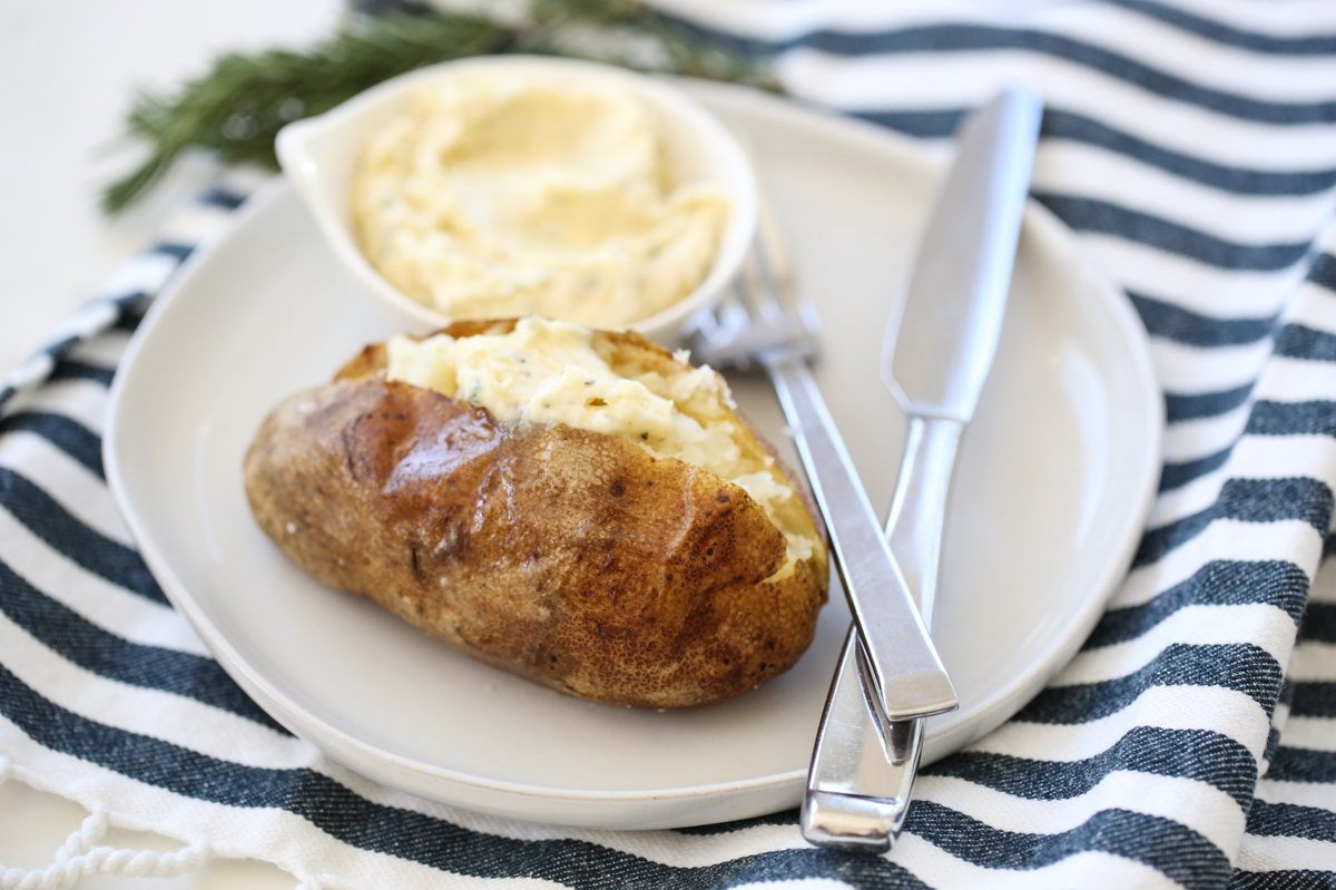 baked potato on a plate with butter