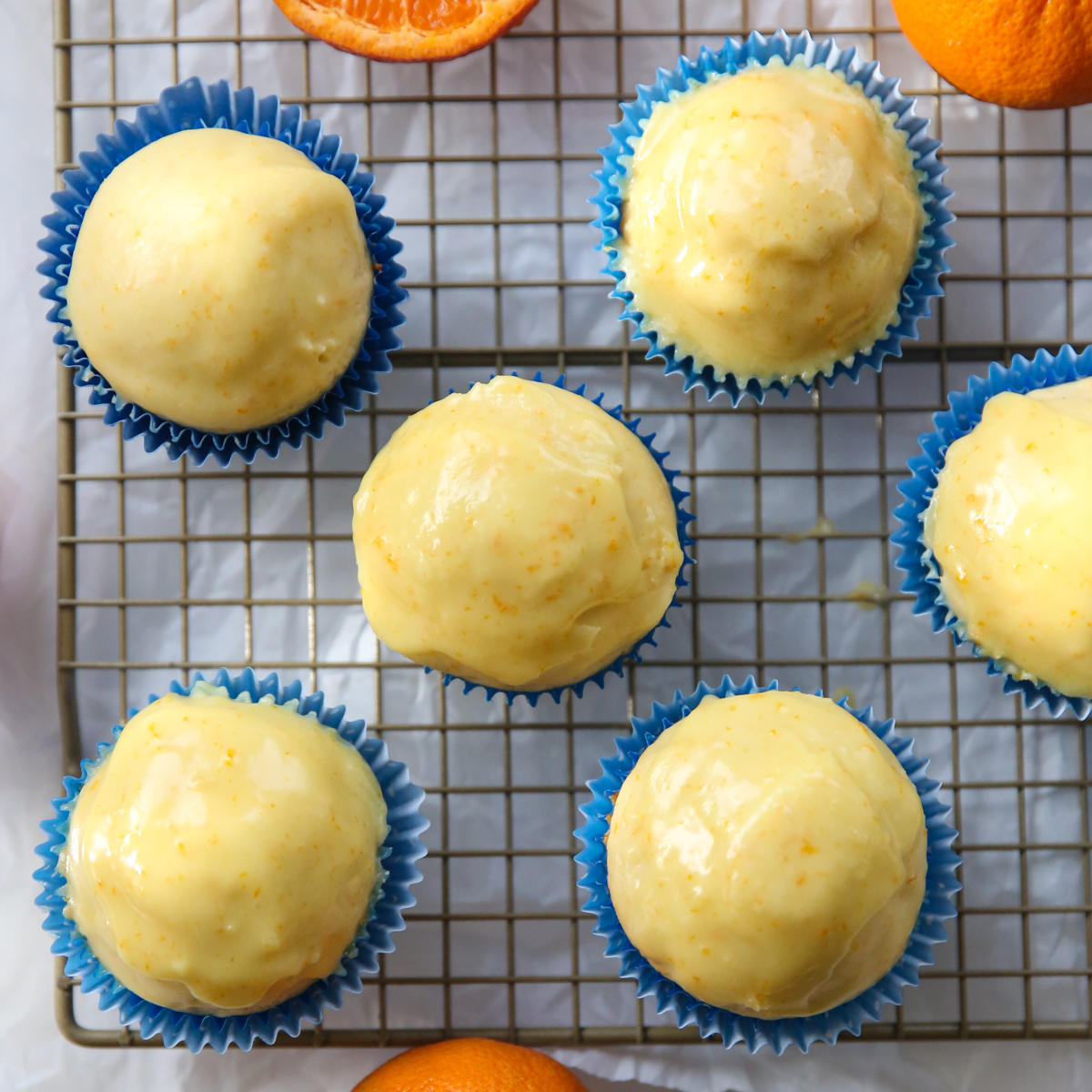 orange buttermilk donuts on a cooling rack