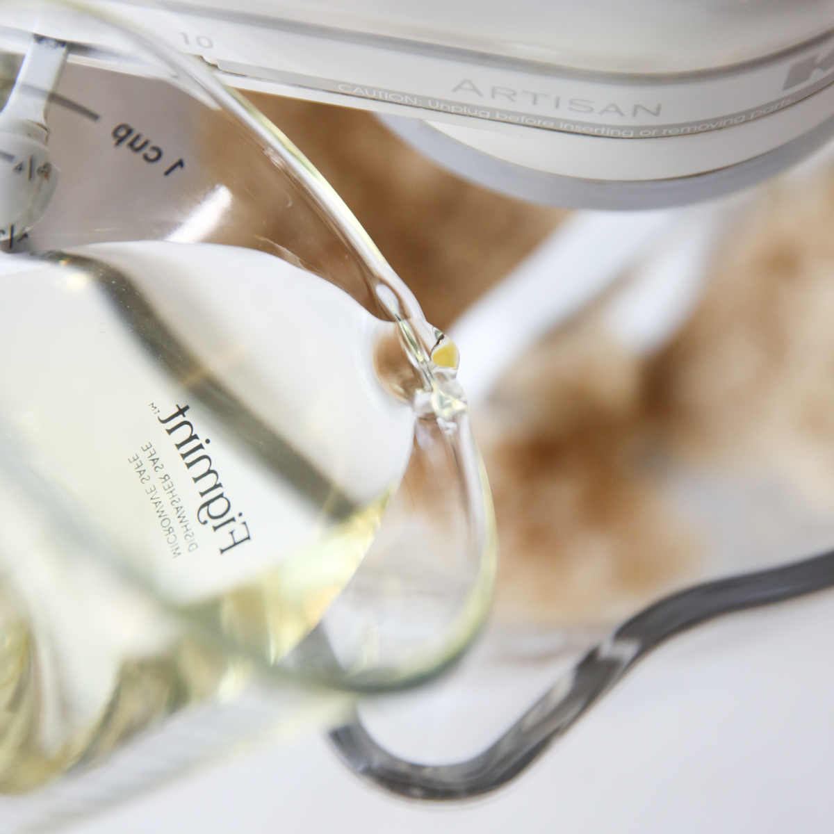 pouring oil into orange zest