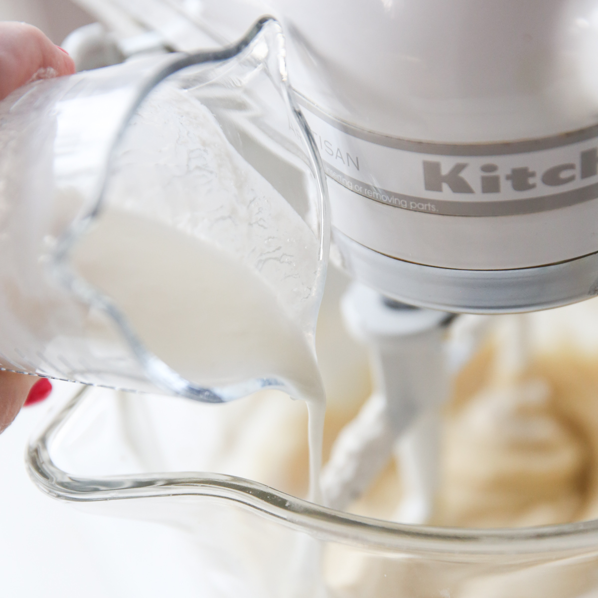 adding buttermilk to mixing bowl