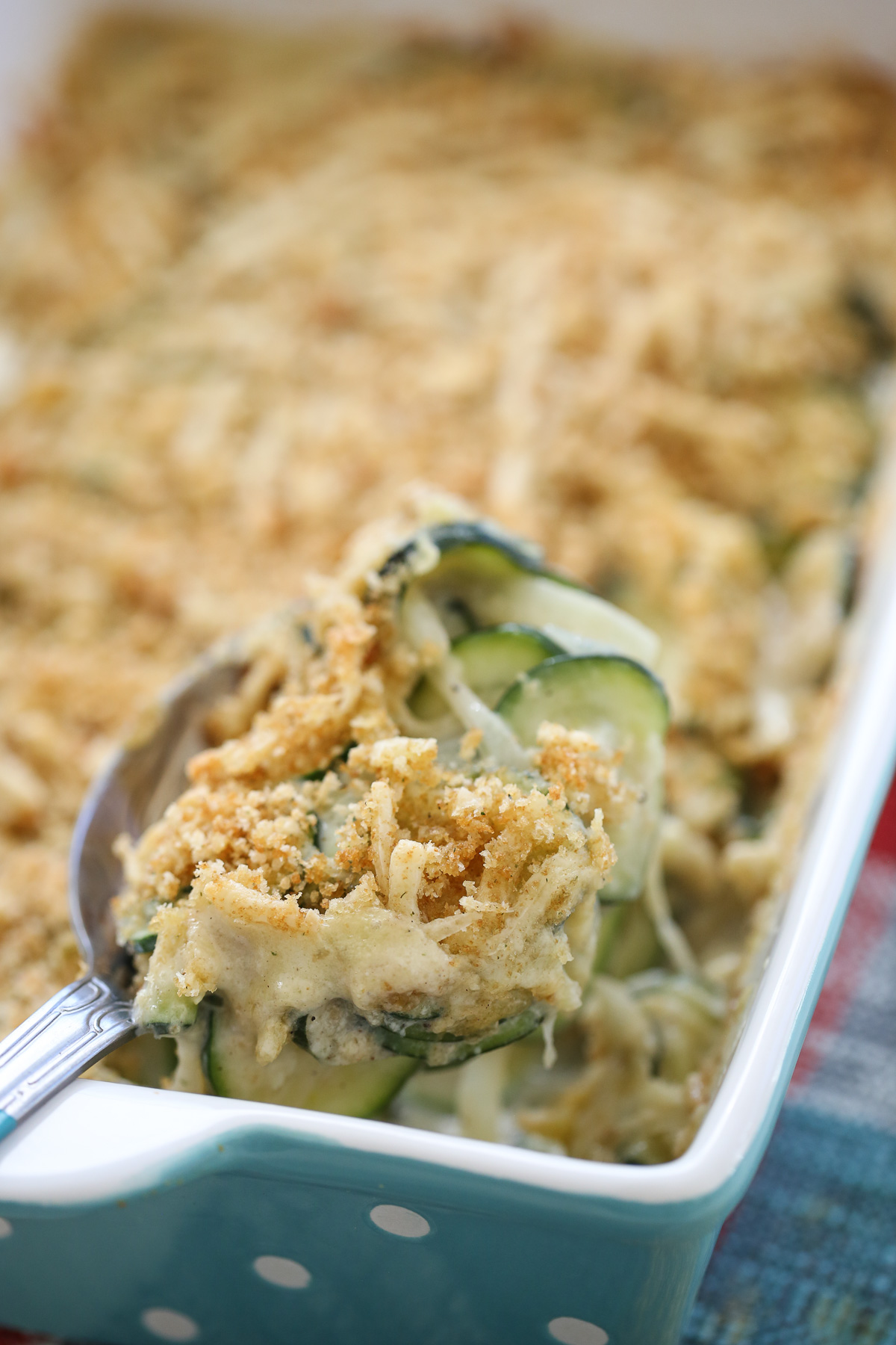 Serving a spoonful of Zucchini gratin