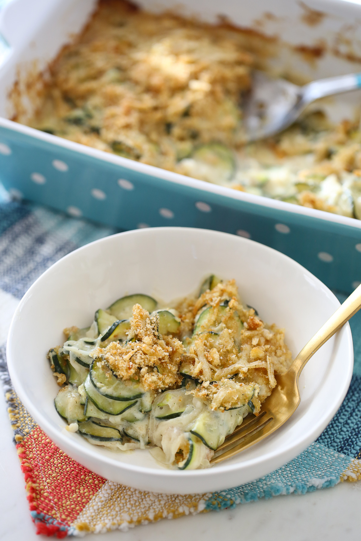 Zucchini gratin in a white bowl