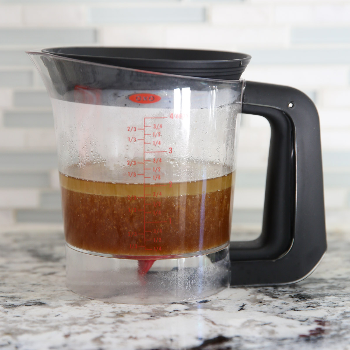 separated meat juice in a container