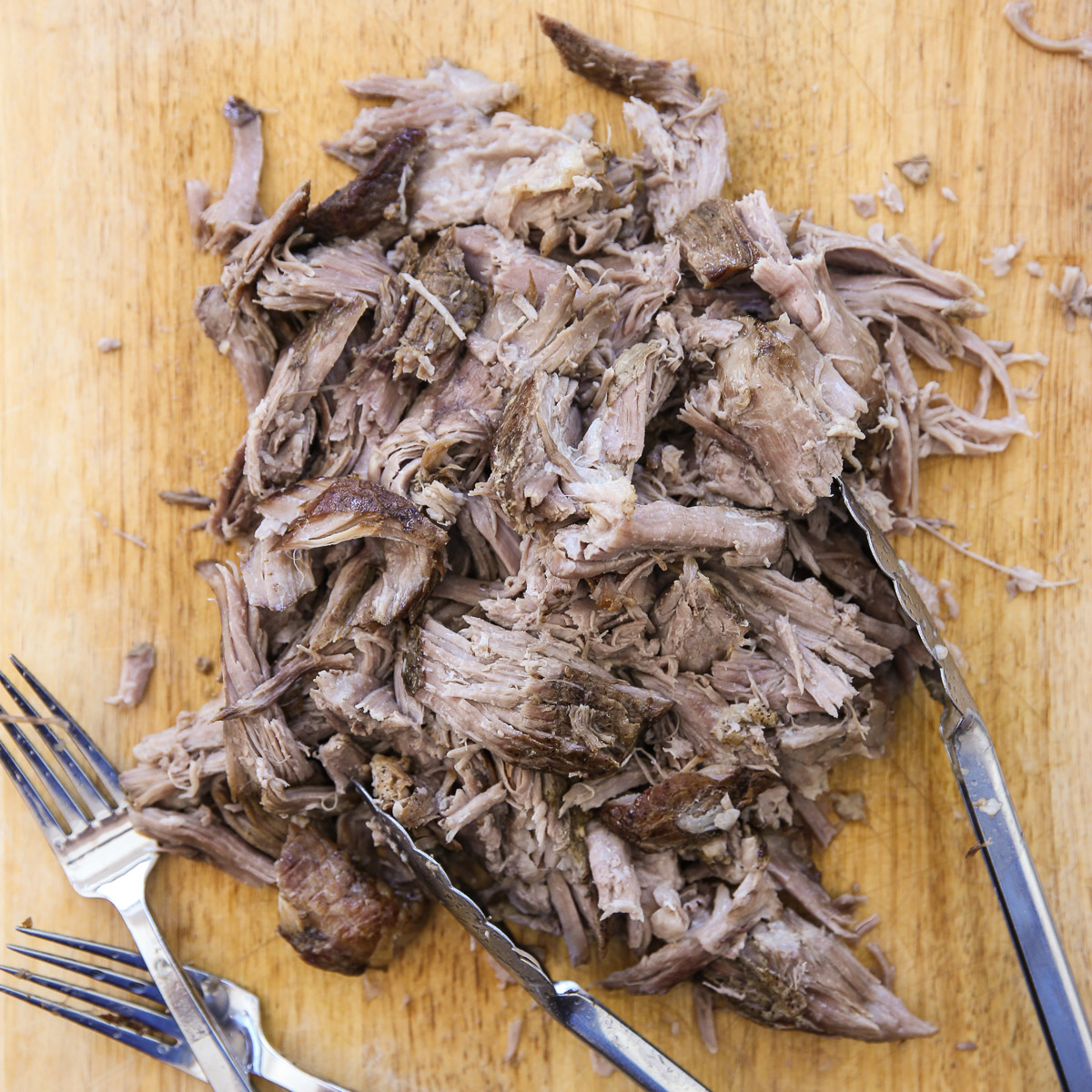 Shredded pork on a cutting board