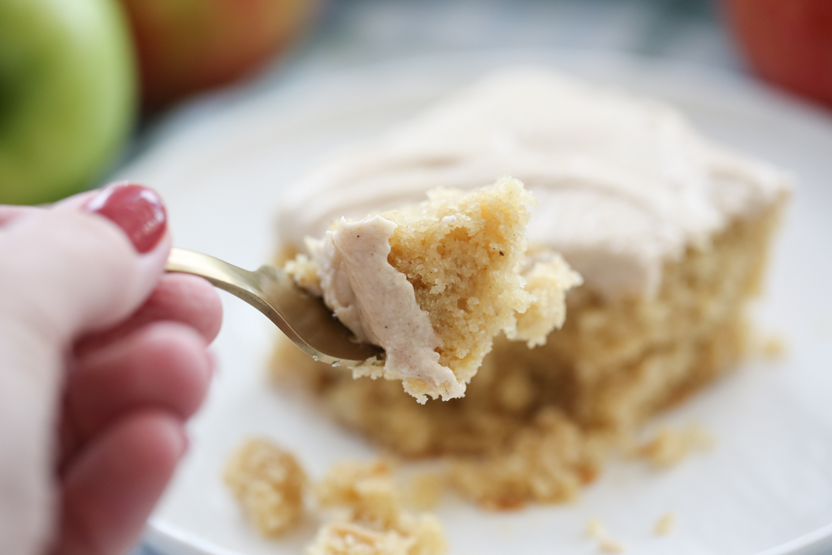 close up bit of our best bites apple snack cake on a gold fork