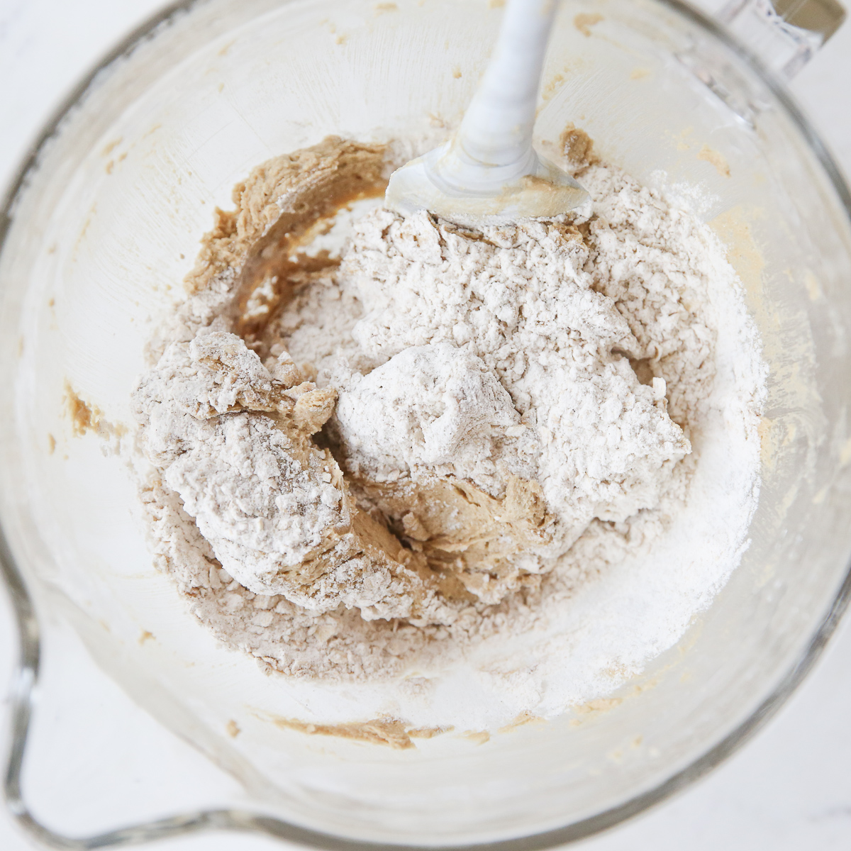 mixing dry ingredients into cookie dough