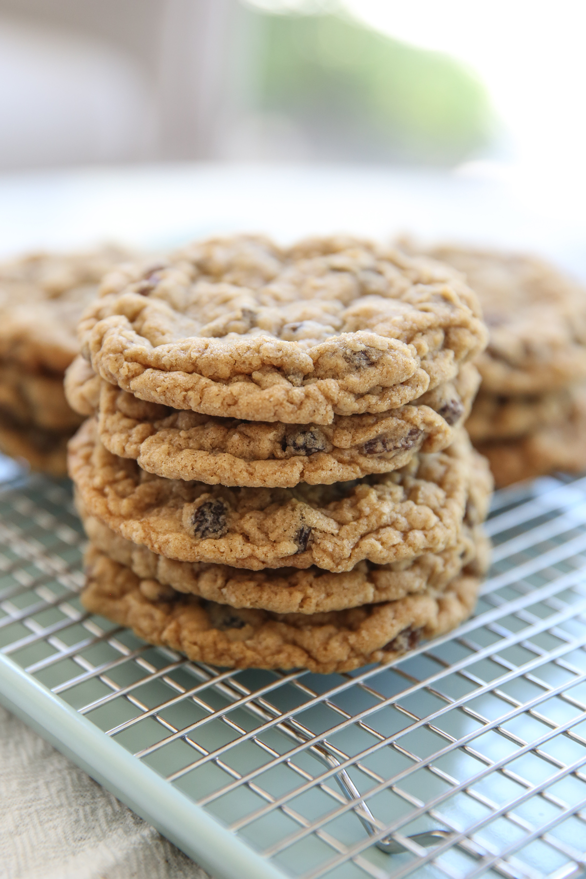 stack of oatmeal raisin cookies on a cooling rack