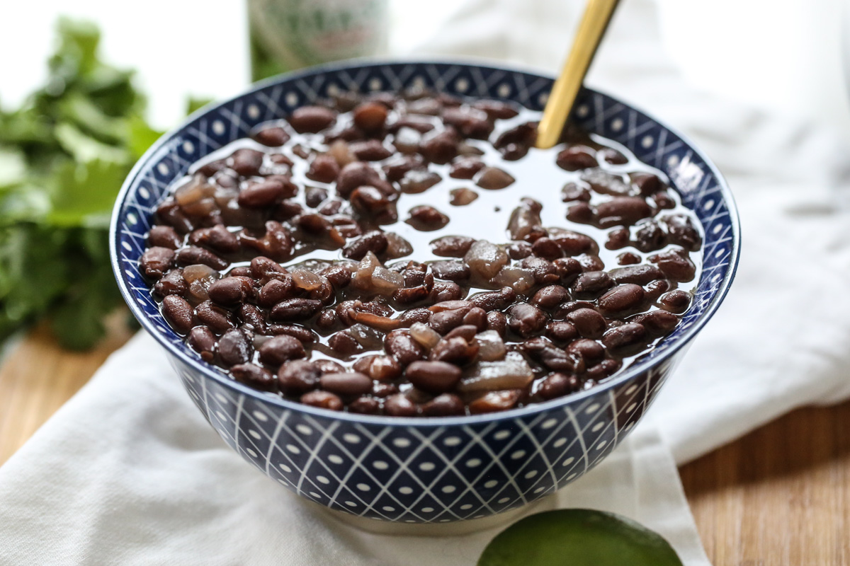 cooked black beans in a blue bowl
