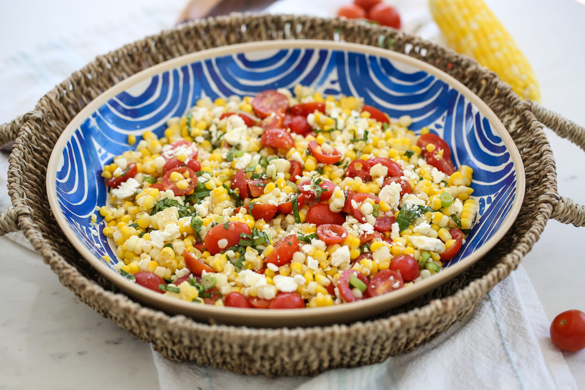 Fresh corn salad in a blue bowl