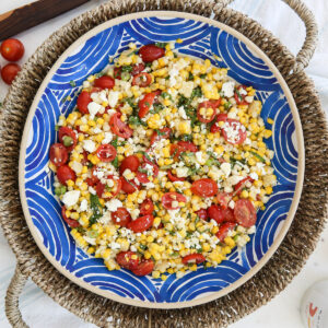 Fresh corn salad in a blue bowl