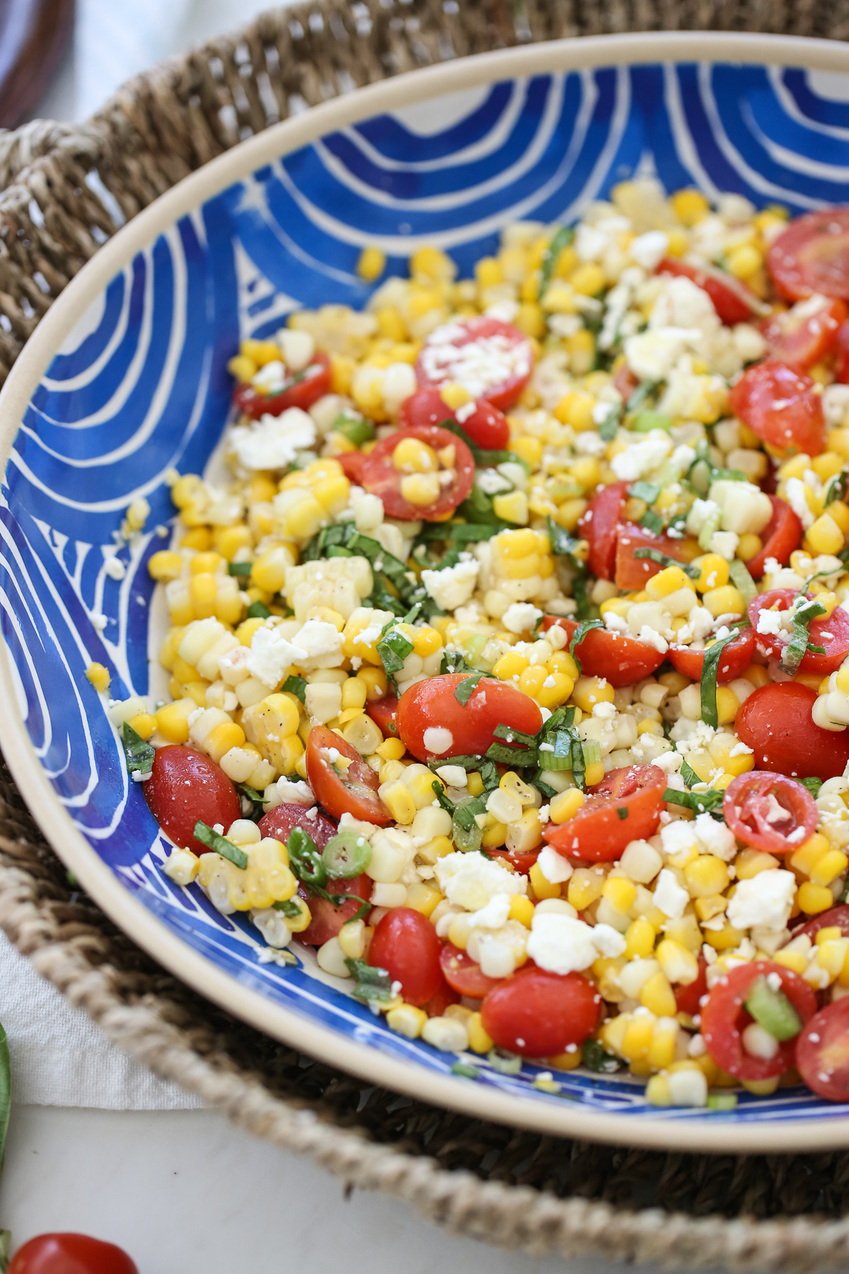 Fresh corn salad in a blue bowl