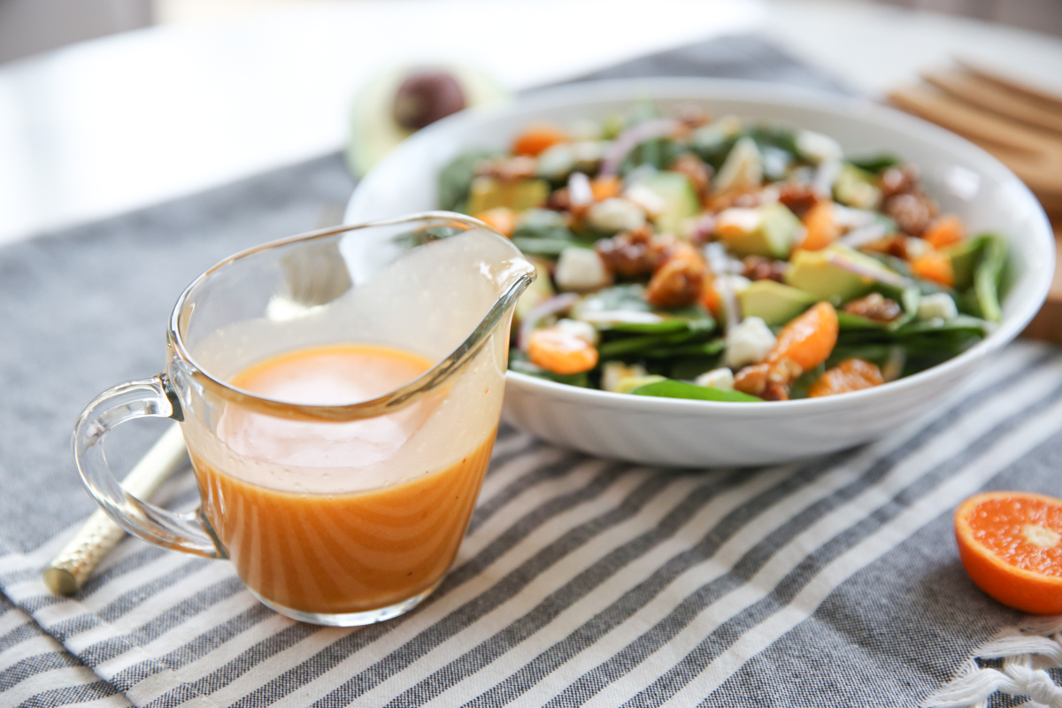big bowl of salad with pepper jelly vinaigrette