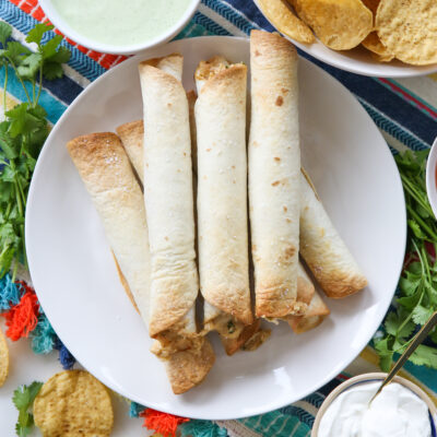 baked taquitos on a platter
