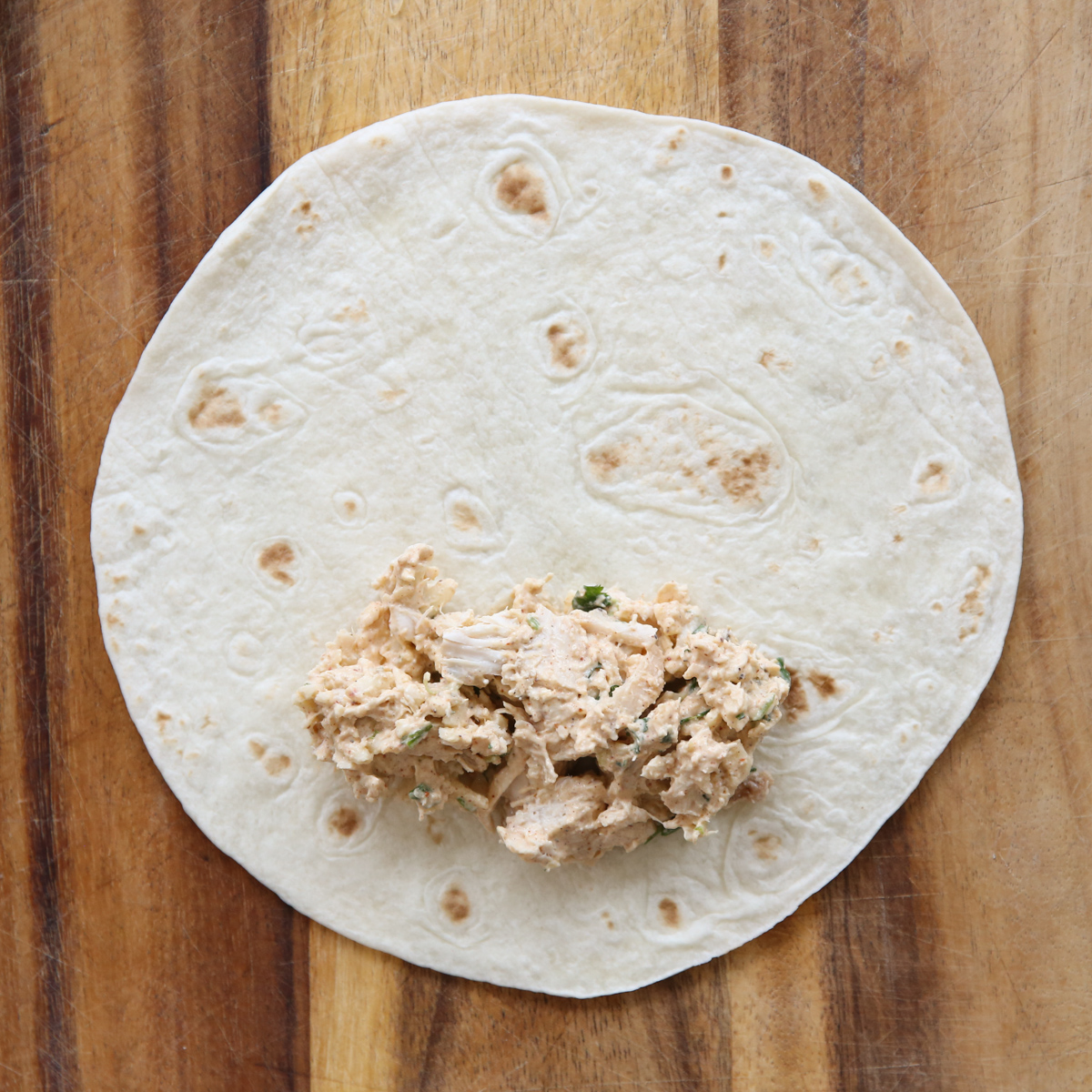 rolling chicken taquitos with filling