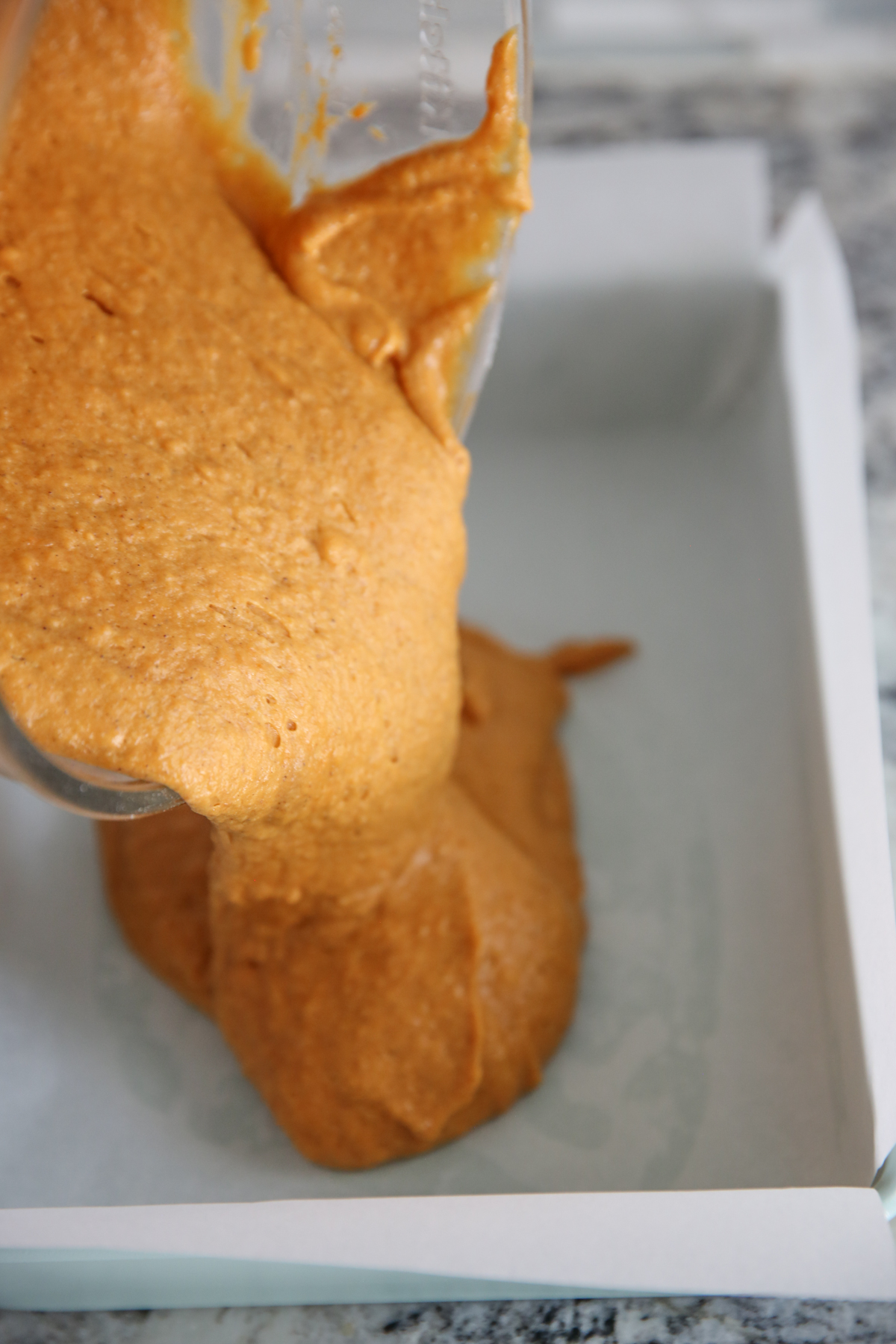 pouring cake into pan
