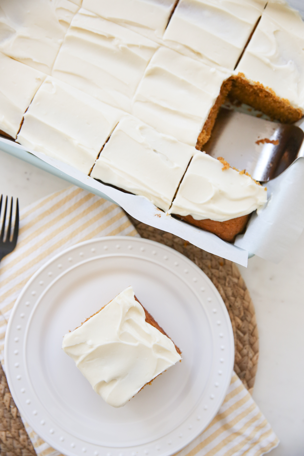 cutting slice of pumpkin cake