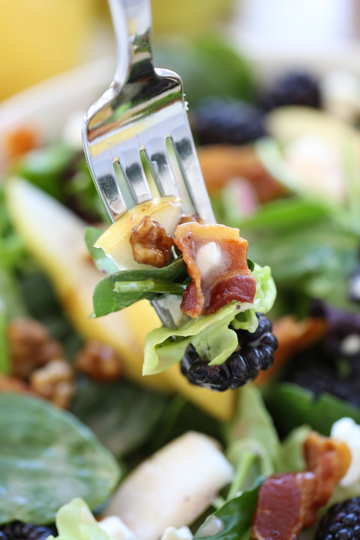 blackberry pear salad on a fork