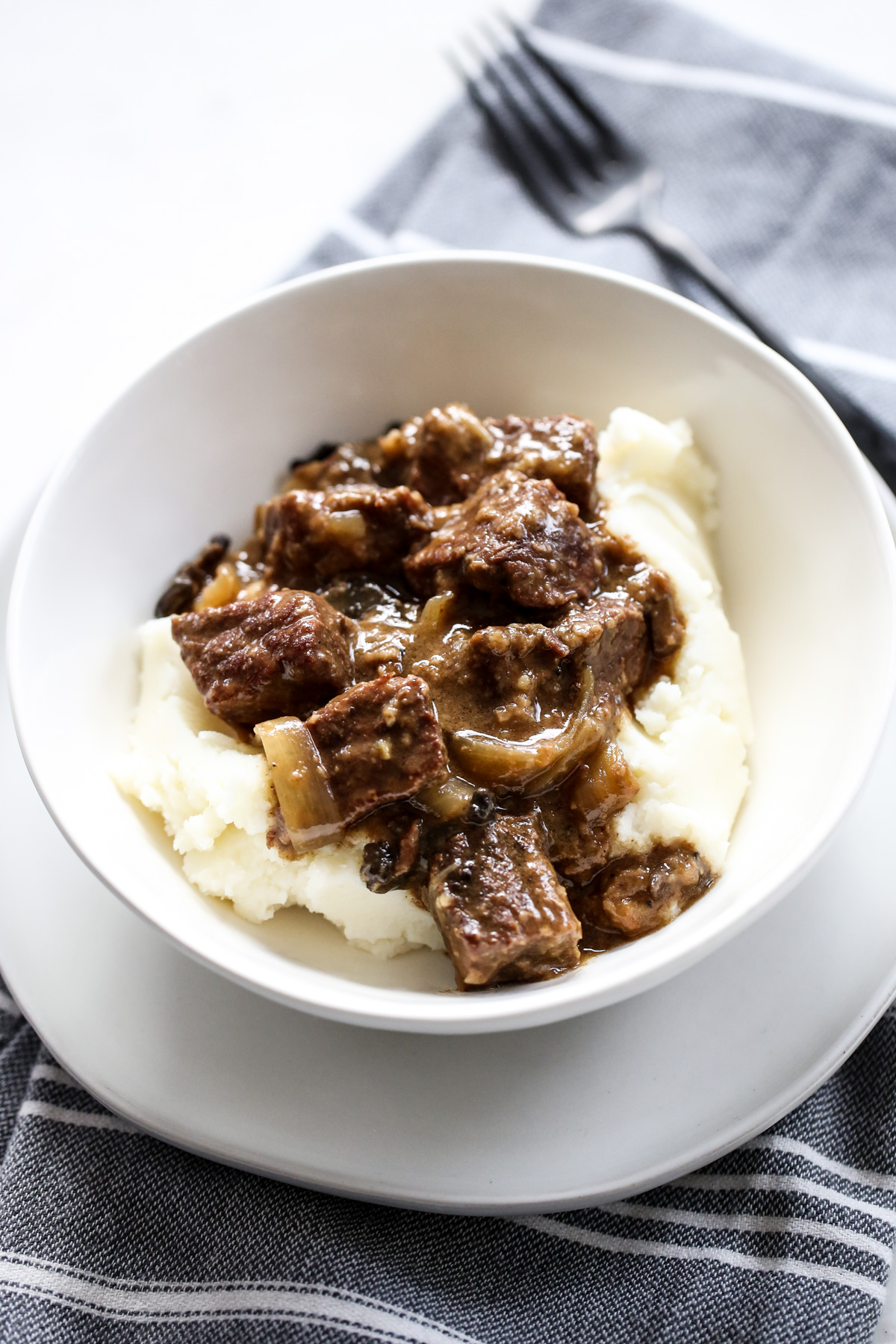 Beef Tips and Gravy in a white bowl