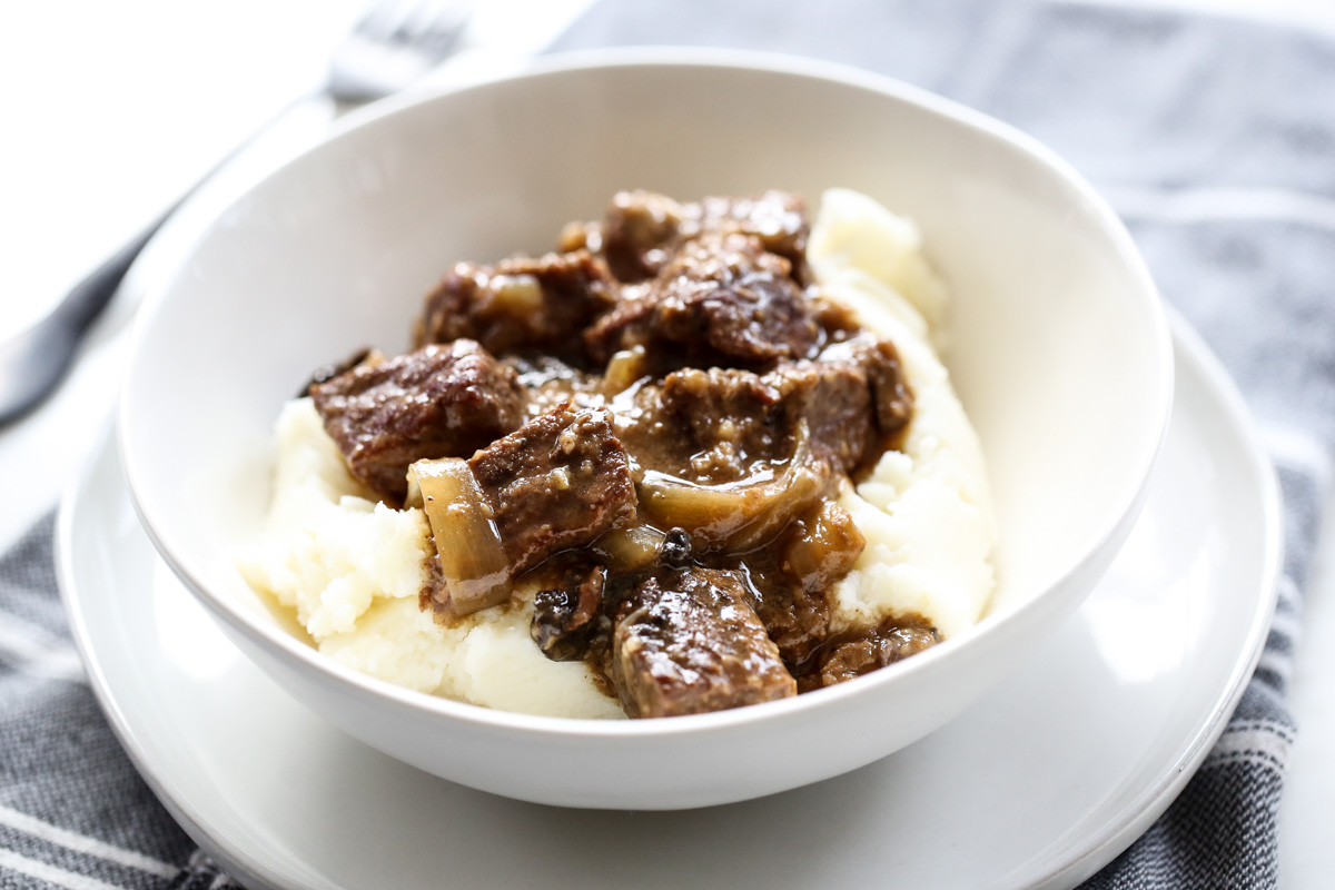 Beef Tips and Gravy in a white bowl