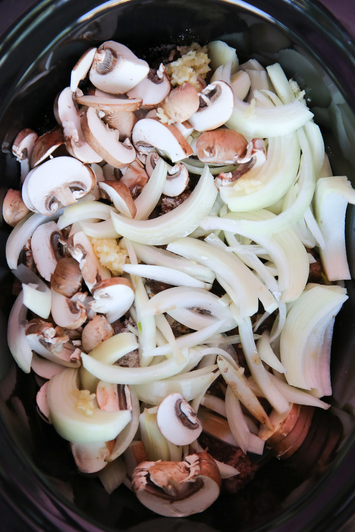 beef and onions in a slowcooker