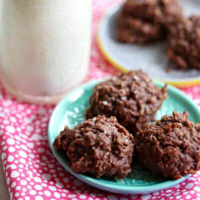 A plate of no-bake chocolate cookies and a glass of milk.