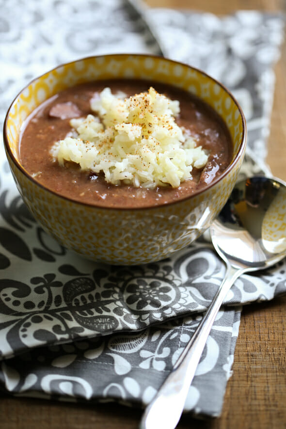 Red Beans and Rice in a bowl, with a spoon. From Our Best Bites.