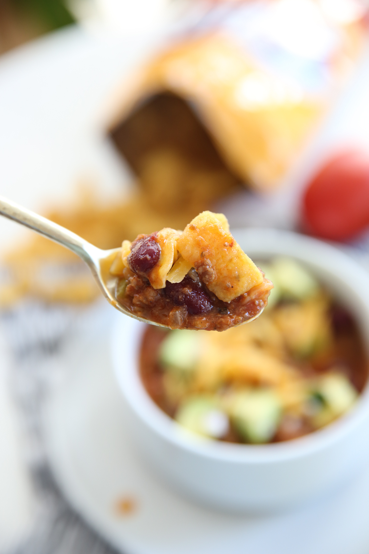 spoon full of Easy Weeknight Chili in a white bowl