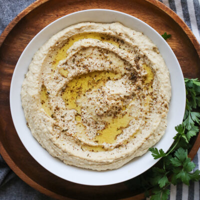 hummus in a bowl with olive oil on top
