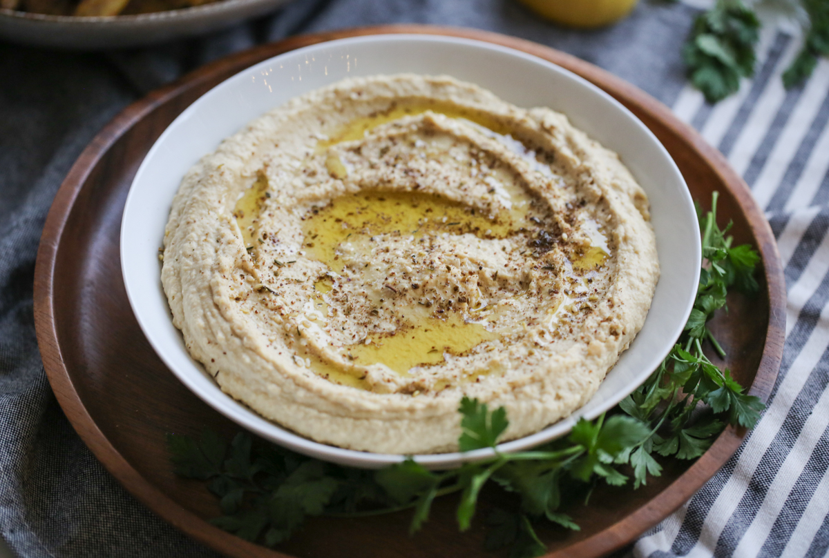 hummus in a bowl with olive oil on top