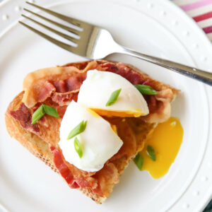 poached egg over toast and bacon