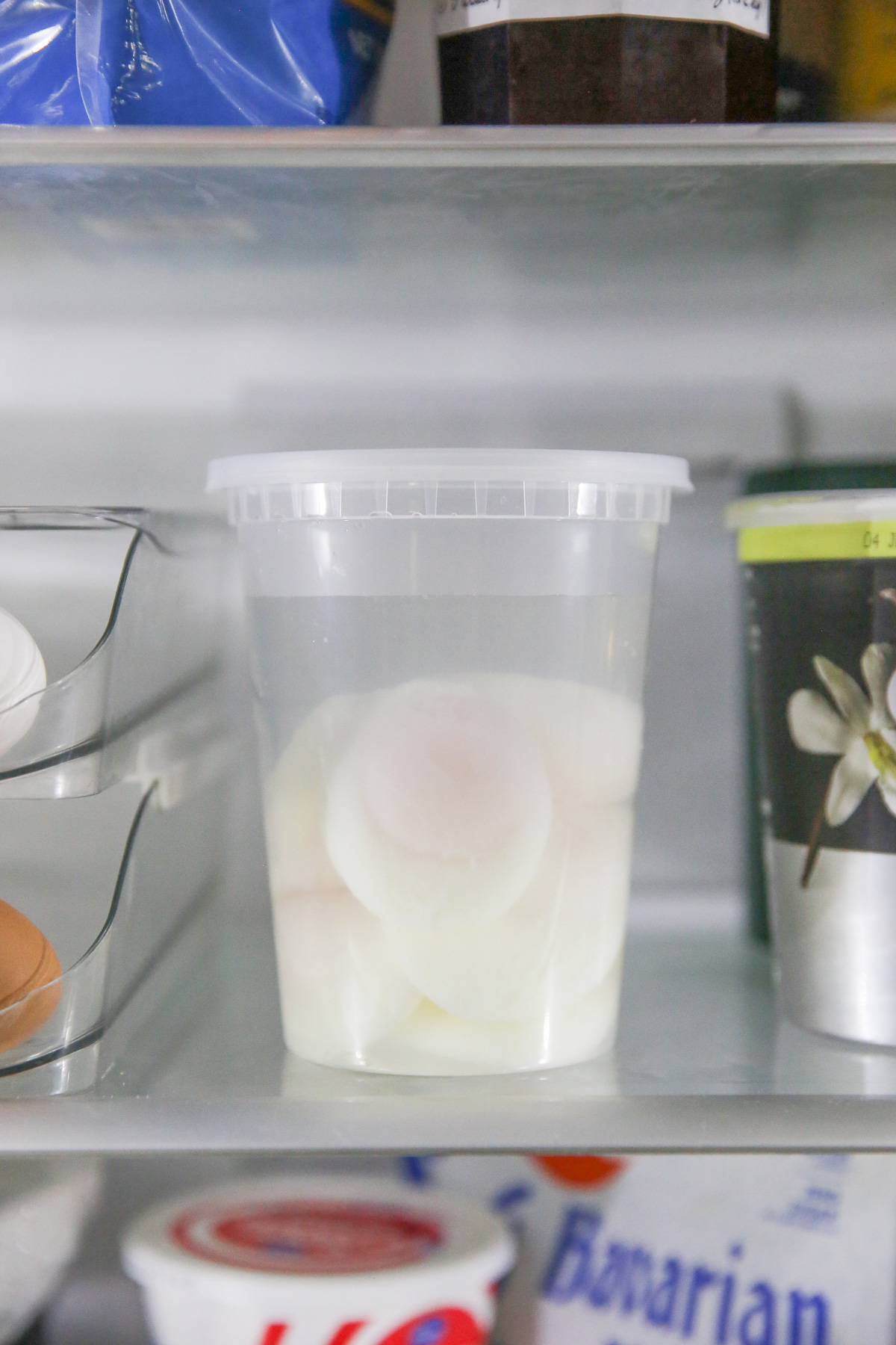 poached egg in a container of water