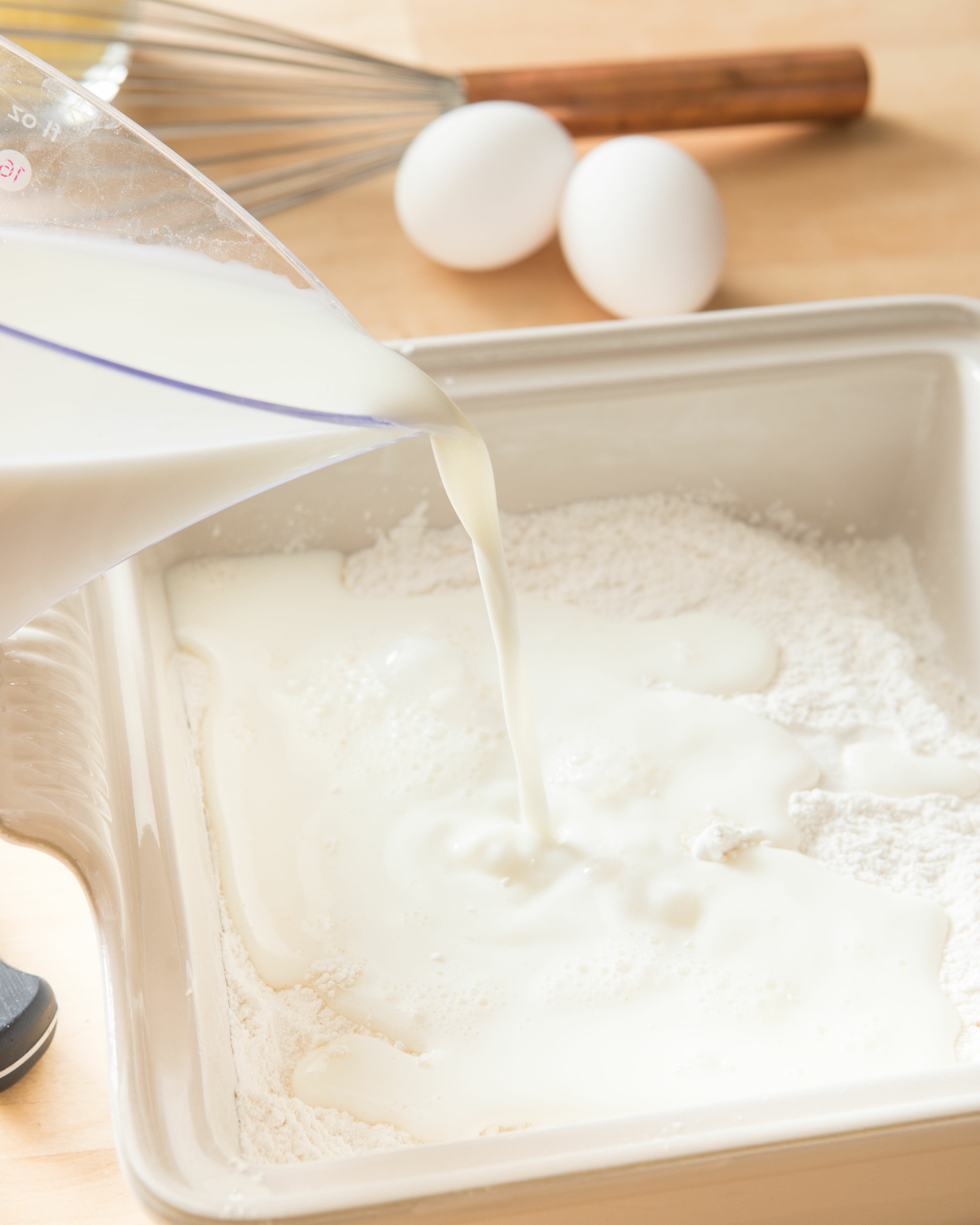 adding milk to french toast batter