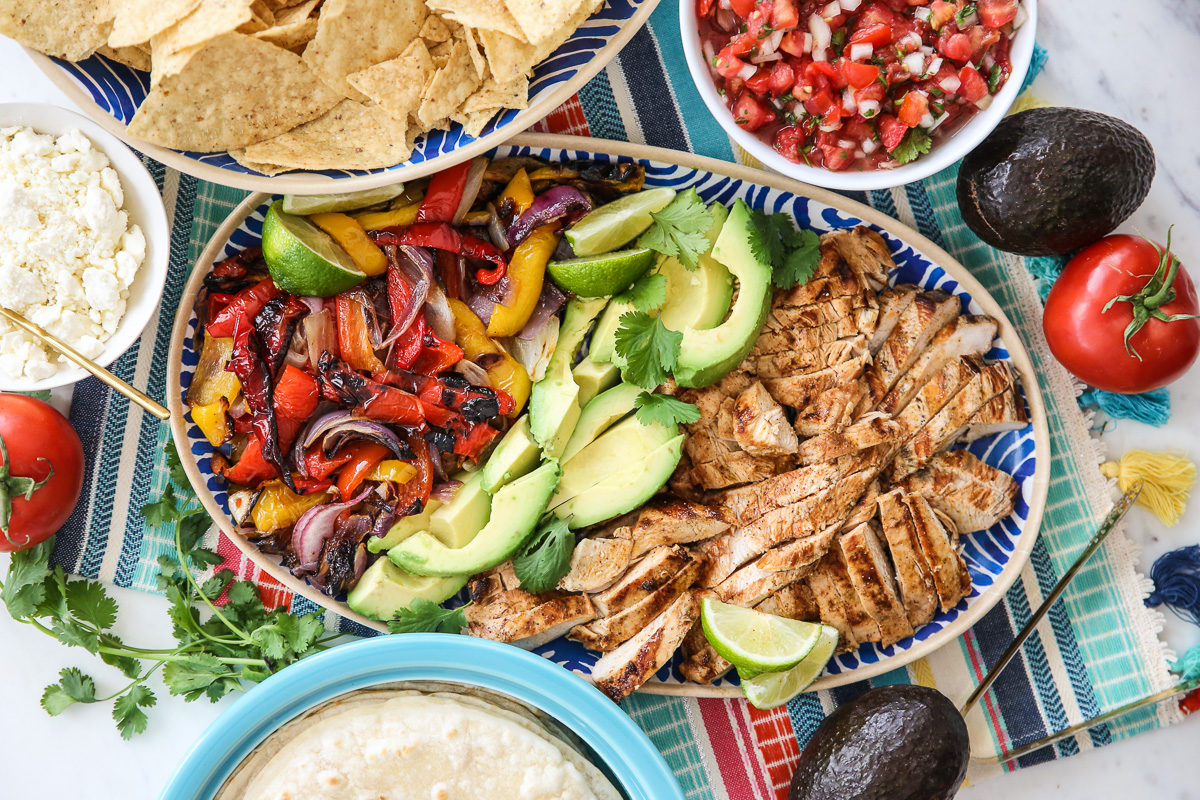 Platter of Fajitas surrounded by toppings