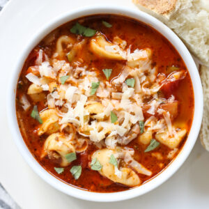 tortellini soup in a white bowl