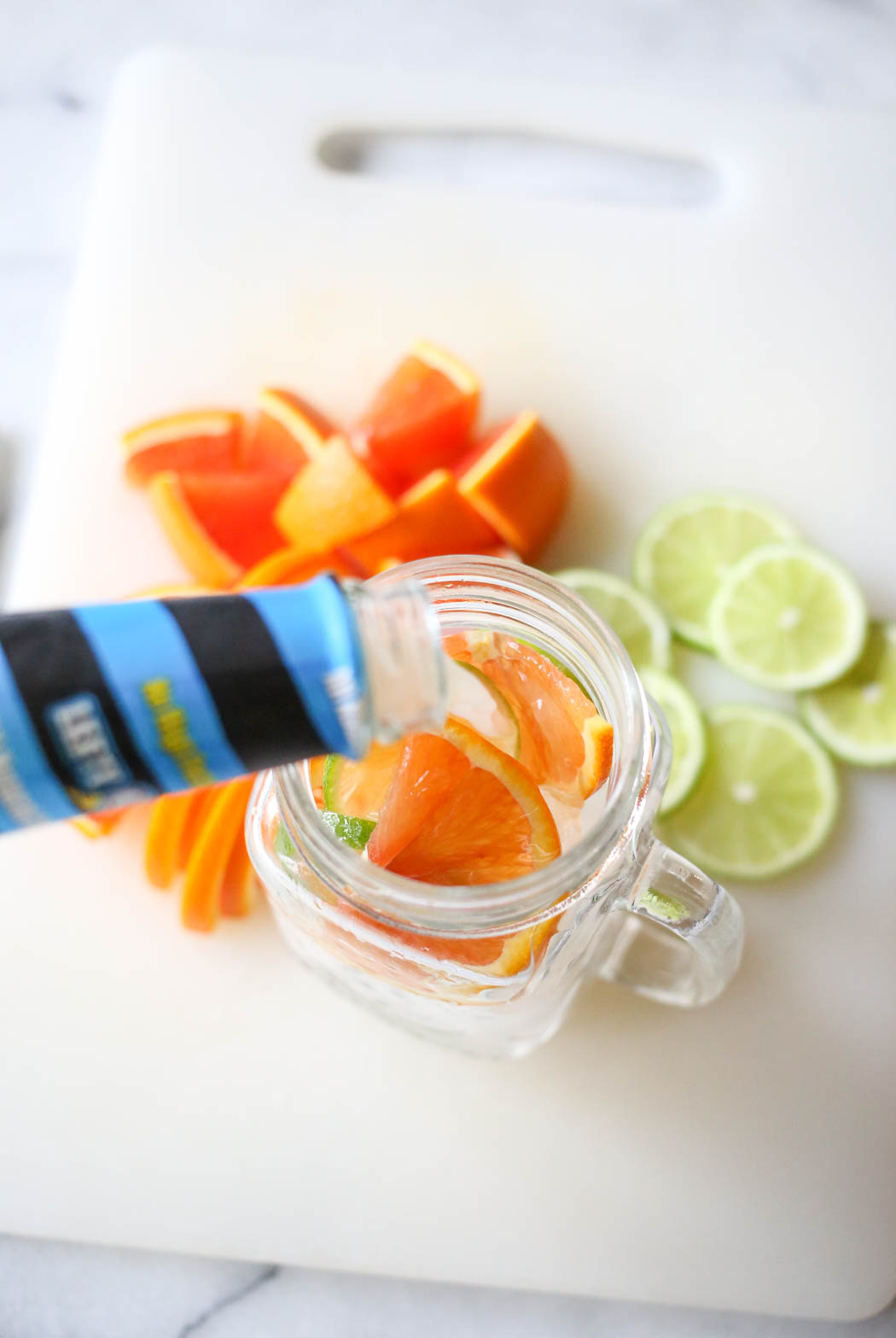 adding margarita mix to glass