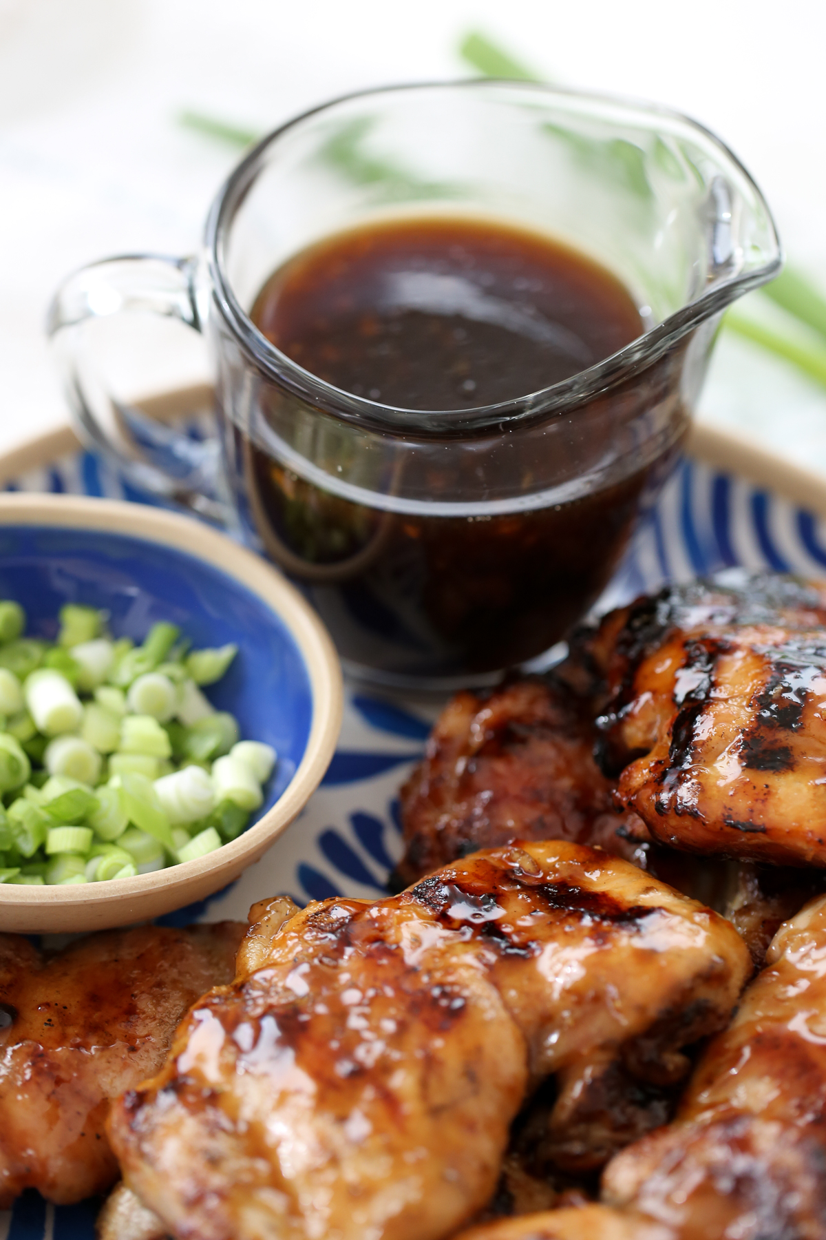 Teriyaki Sauce with on a platter with grilled chicken