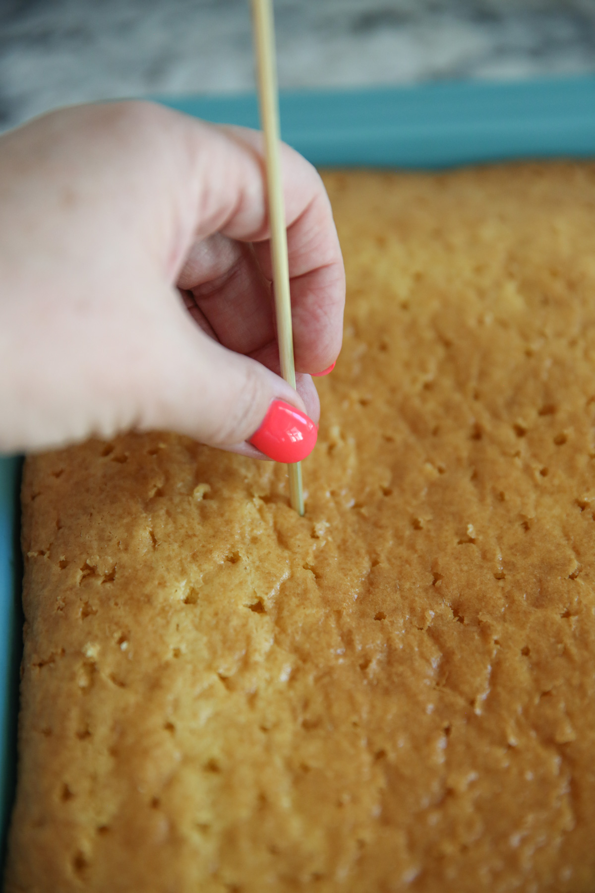 poking holes in cake