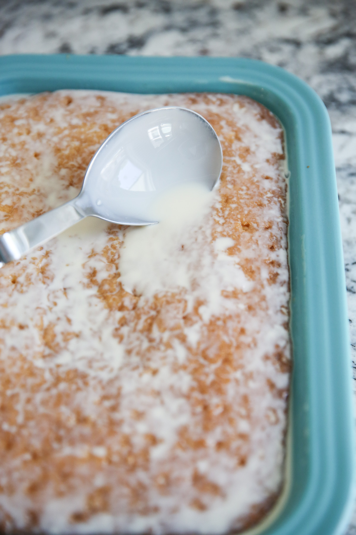 spreading milk on cake